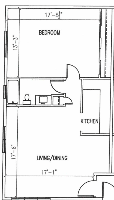 A floor plan of a small apartment with a bedroom, kitchen, and living/dining area.